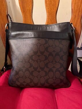 Coach women’s Dark Brown and Black Signature Messenger Bag